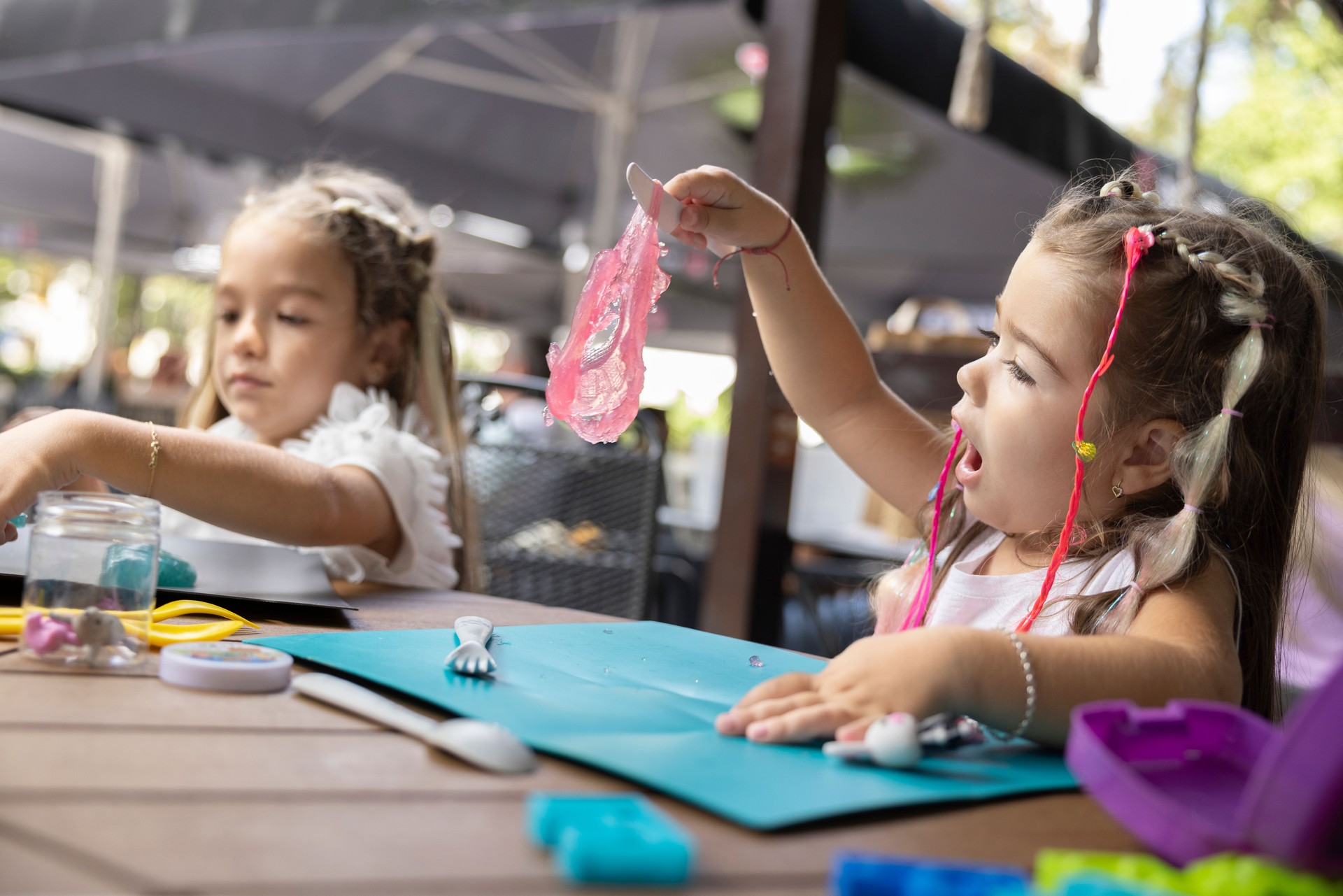 Sisters Enjoying Creative Playtime Indoors